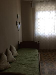 Postel nebo postele na pokoji v ubytování Villa L'Ottagono con cucina parcheggio privato telecamerizzato e wifi