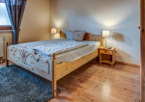 Ein Bett oder Betten in einem Zimmer der Unterkunft Landhaus-Pension Am Pfaffensee