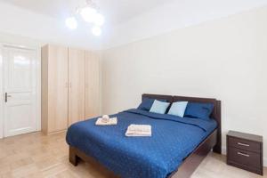 Postel nebo postele na pokoji v ubytování Historic centre-spacious apartment