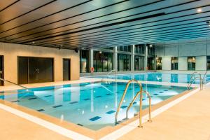 a large swimming pool in a building at Rafa Nadal Residence in Manacor