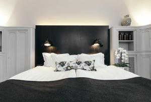 Postelja oz. postelje v sobi nastanitve Apótek Hotel Reykjavík by Keahotels