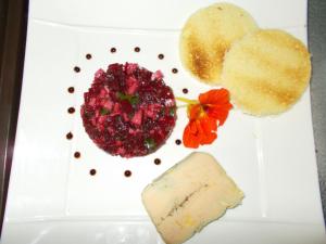 a plate of food with a raspberry and bread at Hotel Chaumiere - in Tournon-sur-Rhône