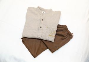 a white shirt and brown shorts on a white background at Dormy Inn Premium Shibuya-jingumae in Tokyo