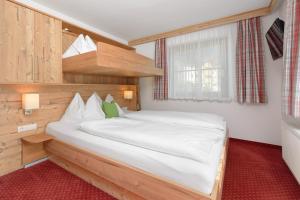 Ein Bett oder Betten in einem Zimmer der Unterkunft Pension Haus am Dorfplatz