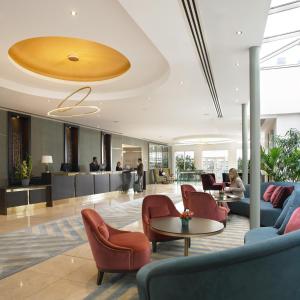 a lobby with couches and chairs and a table at Dunboyne Castle Hotel & Spa in Dunboyne