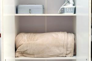 a towel sitting on a shelf in a closet at Loft La Plata in La Plata