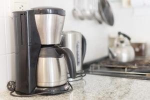 a coffee maker sitting on a counter in a kitchen at Loft La Plata in La Plata