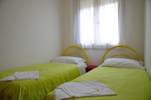 Posteľ alebo postele v izbe v ubytovaní Aurora Residence