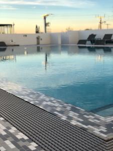 a swimming pool with water in the middle of it at Wyndham Garden Ft Lauderdale Airport & Cruise Port in Dania Beach