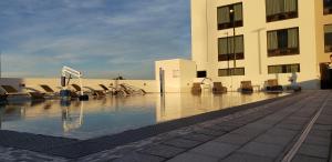 a pool of water in front of a building at Wyndham Garden Ft Lauderdale Airport & Cruise Port in Dania Beach