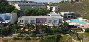 an aerial view of a resort with a swimming pool at Erytha Hotel & Resort Chios in Karfas