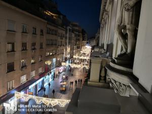 a view of a city street at night with christmas lights at Knez Mihailova Apartman in Belgrade