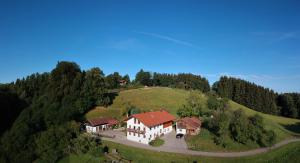 an aerial view of a house on a hill at Ferienwohnung Fritzenwenger in Übersee