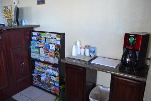 a kitchen with a counter with a coffee maker on it at Budget Inn in Needles