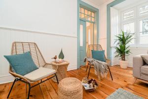 a living room with two chairs and a couch at Blue & Bright Apartment in Baixa in Lisbon