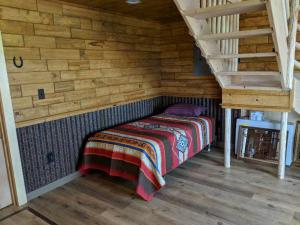 Ein Bett oder Betten in einem Zimmer der Unterkunft K3 Guest Ranch
