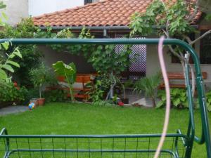 a batting cage in the backyard of a house at Coral Family Hotel in Chernomorets