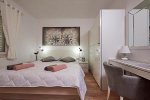 Posteľ alebo postele v izbe v ubytovaní Apartments Proto