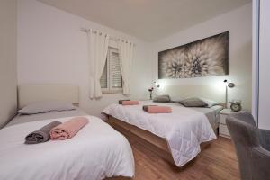 Posteľ alebo postele v izbe v ubytovaní Apartments Proto