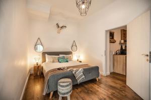 En eller flere senge i et værelse på Venice Boutique Aparthotel