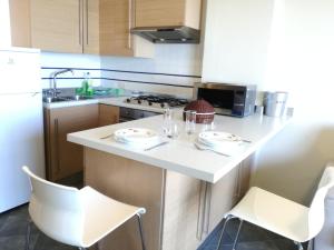 A kitchen or kitchenette at La Maison De Marie