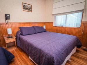 Cama ou camas em um quarto em Hostal Chalet Las Violetas