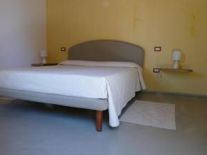 Cama o camas de una habitación en La Scala Guesthouse