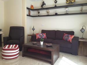 a living room with a couch and a coffee table at Amazing Condo in Alicante City Center in Alicante