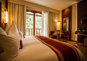 En eller flere senge i et værelse på Sumaq Machu Picchu Hotel