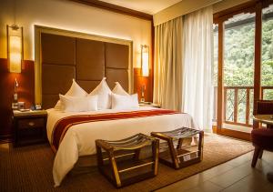 Cama ou camas em um quarto em Sumaq Machu Picchu Hotel