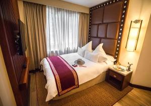 Cama ou camas em um quarto em Sumaq Machu Picchu Hotel