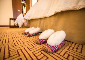Cama ou camas em um quarto em Sumaq Machu Picchu Hotel
