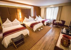 Cama ou camas em um quarto em Sumaq Machu Picchu Hotel