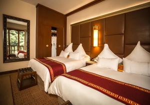 Cama ou camas em um quarto em Sumaq Machu Picchu Hotel