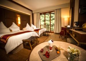 Cama ou camas em um quarto em Sumaq Machu Picchu Hotel