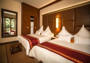 Cama ou camas em um quarto em Sumaq Machu Picchu Hotel
