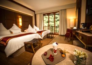 Cama ou camas em um quarto em Sumaq Machu Picchu Hotel