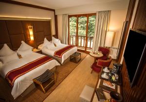 Cama ou camas em um quarto em Sumaq Machu Picchu Hotel