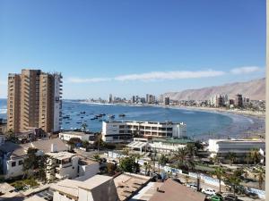 a view of a city with a beach and buildings at DEPTO SUITE II in Iquique