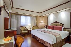 Voodi või voodid majutusasutuse Charming City Songshan Hotel toas