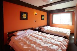 Postel nebo postele na pokoji v ubytování Royal Hotel