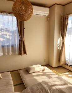 Llit o llits en una habitació de near to Miyajima