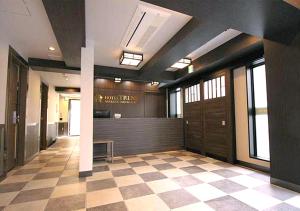 a lobby with a waiting area in a building at Hotel Trend Asakusa Tawaramachi in Tokyo