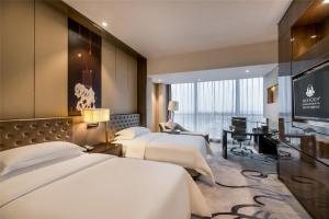 Postel nebo postele na pokoji v ubytování Minyoun Chengdu Kehua Hotel – Member of Preferred Hotels & Resorts