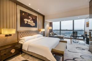 Postel nebo postele na pokoji v ubytování Minyoun Chengdu Kehua Hotel – Member of Preferred Hotels & Resorts