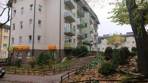 a building with stairs in front of a building at Grzyminska in Szczecin