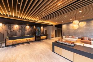 a lobby with two couches and a table at Tokyu Stay Sapporo Odori in Sapporo