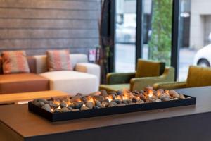 a fireplace on a table in a living room at Tokyu Stay Sapporo Odori in Sapporo