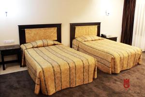 Кровать или кровати в номере Гостиница Grand Mir