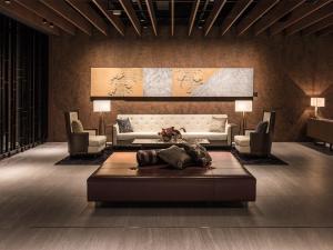 a living room with a couch and a table at Hakodate Kokusai Hotel in Hakodate